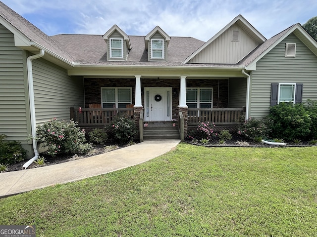 18 Vernon Rd NE, Rome, GA 30165 - view of front of house featuring a front lawn, board and batten siding, a porch, and a shingled roof