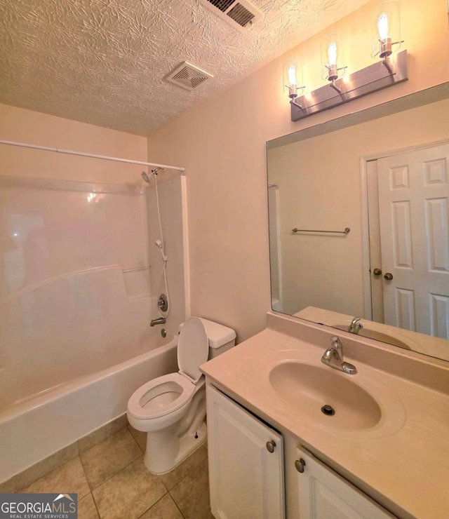 full bath featuring visible vents, toilet, a textured ceiling, tile patterned flooring, and vanity