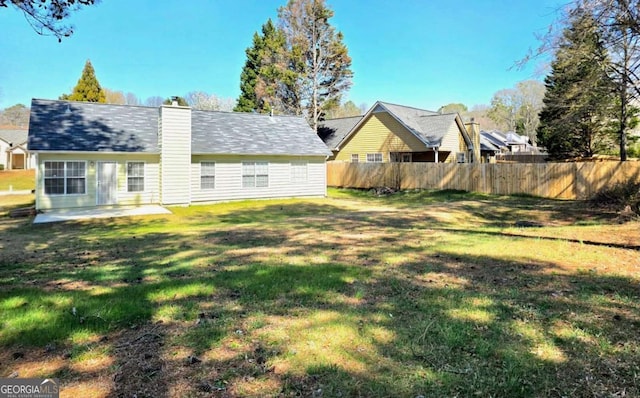 view of yard featuring a patio and fence