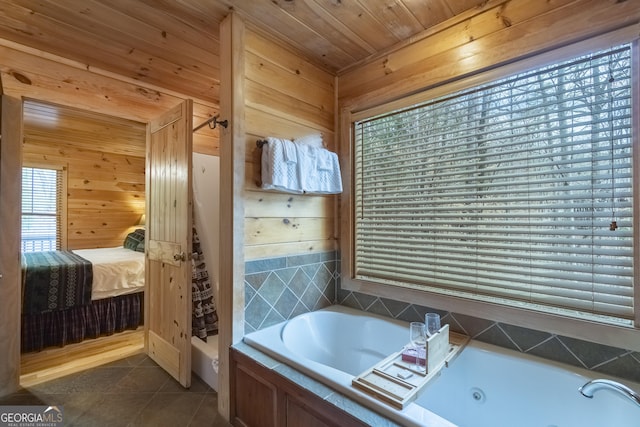 full bathroom with tile patterned floors, ensuite bath, a tub with jets, wood walls, and wood ceiling