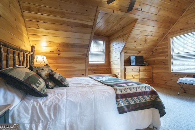 bedroom featuring wooden ceiling, wooden walls, carpet floors, and vaulted ceiling