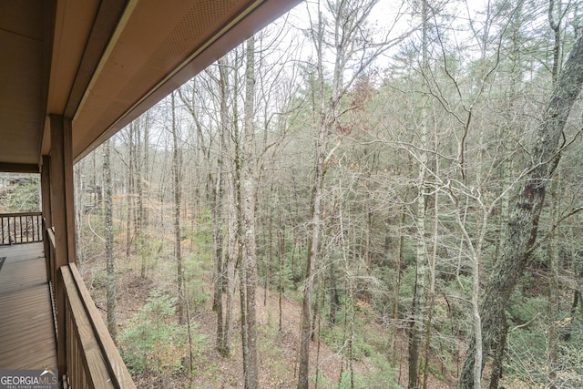 deck featuring a view of trees