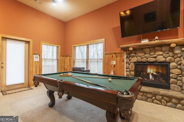 rec room with a wainscoted wall, a fireplace, visible vents, and carpet floors