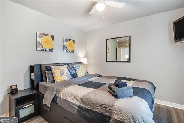 1041 Lawton Ave SW, Atlanta, GA 30310 - bedroom with ceiling fan, baseboards, and wood finished floors