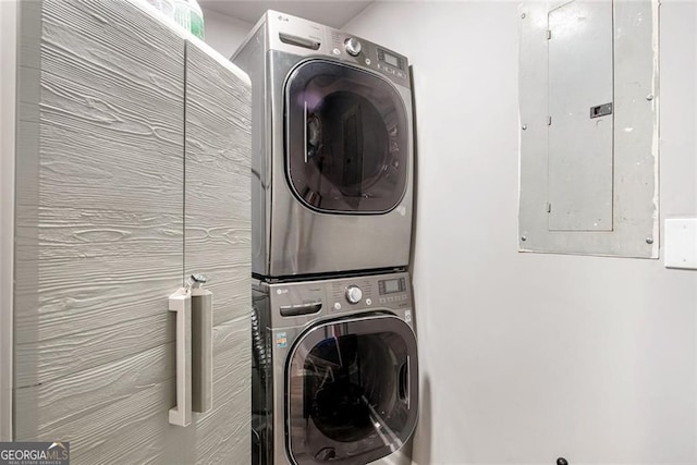 1041 Lawton Ave SW, Atlanta, GA 30310 - clothes washing area featuring electric panel, stacked washer and dryer, and laundry area