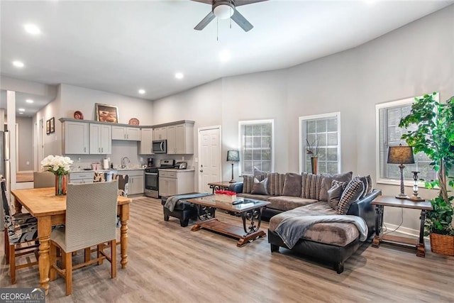 1041 Lawton Ave SW, Atlanta, GA 30310 - living area featuring recessed lighting, a high ceiling, light wood-type flooring, and a ceiling fan