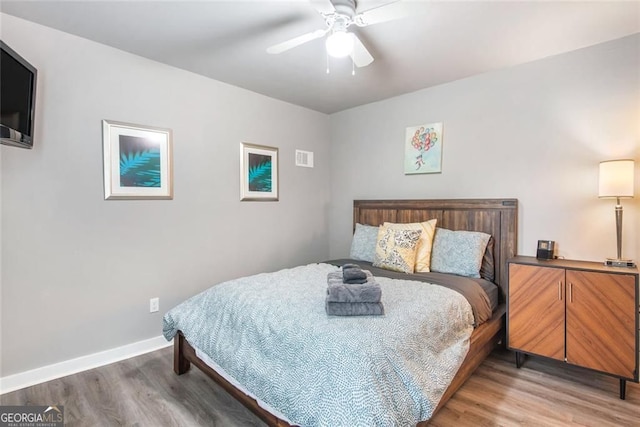1041 Lawton Ave SW, Atlanta, GA 30310 - bedroom featuring light wood-type flooring, baseboards, and ceiling fan