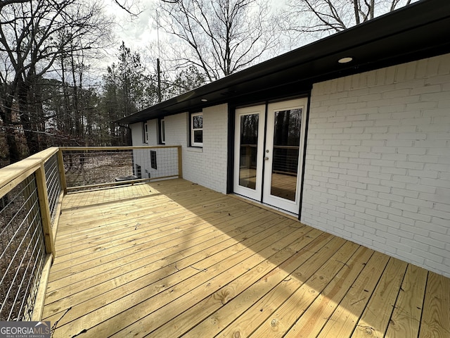 wooden terrace featuring french doors