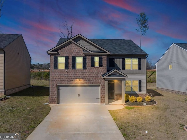 view of front facade featuring driveway, an attached garage, board and batten siding, a lawn, and brick siding