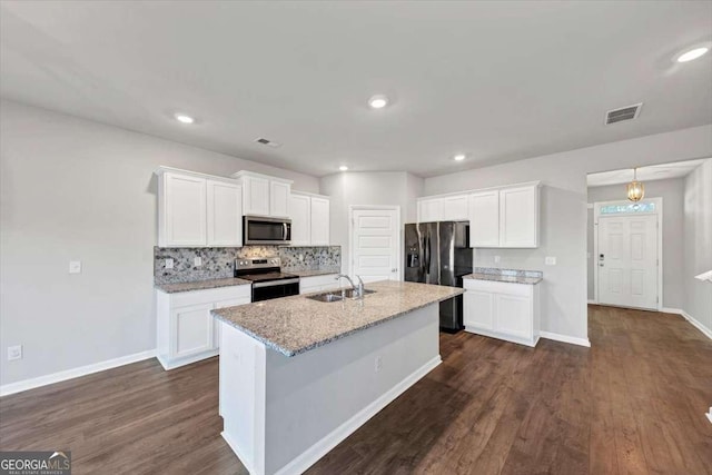 kitchen featuring white cabinetry, dark wood-style floors, visible vents, and stainless steel appliances