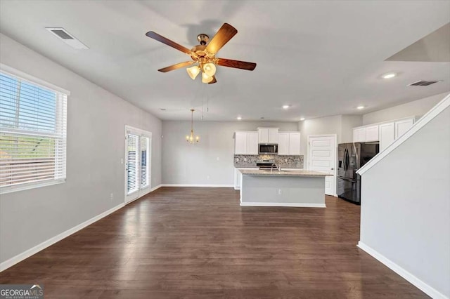 kitchen featuring decorative backsplash, dark wood-type flooring, visible vents, and appliances with stainless steel finishes