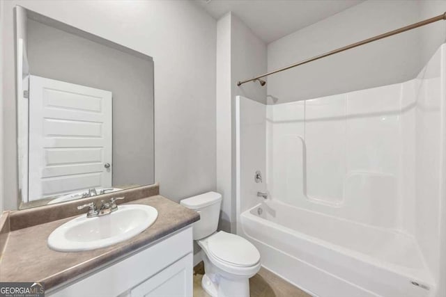 bathroom with vanity, shower / tub combination, and toilet