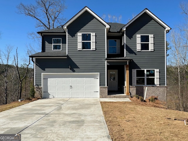 traditional-style home with brick siding, concrete driveway, a garage, and roof with shingles