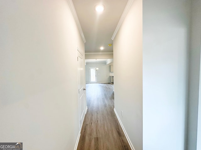 hall with recessed lighting, baseboards, wood finished floors, and ornamental molding