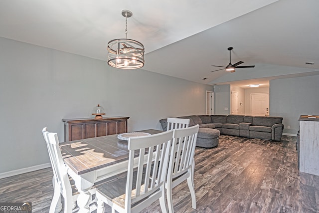 dining space featuring vaulted ceiling, baseboards, dark wood-type flooring, and visible vents