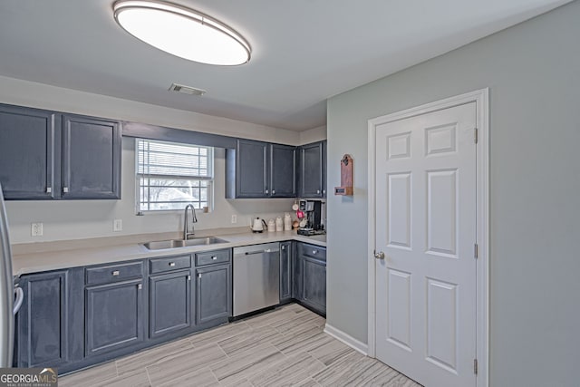 kitchen featuring a sink, light countertops, visible vents, and stainless steel appliances