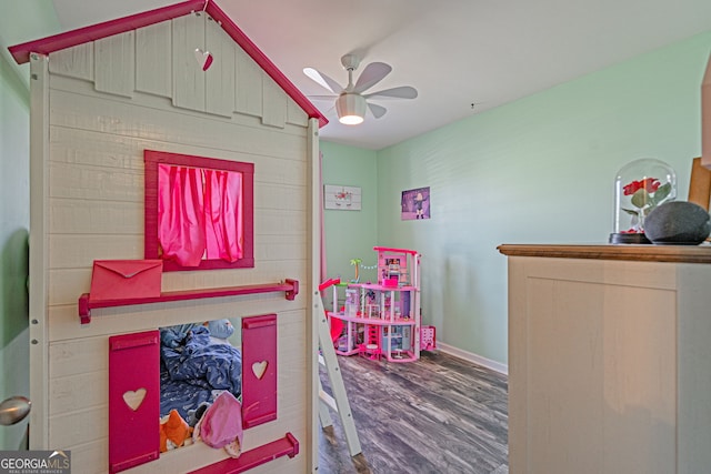 game room with wood finished floors, baseboards, and ceiling fan