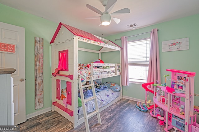 bedroom with visible vents, ceiling fan, baseboards, and wood finished floors