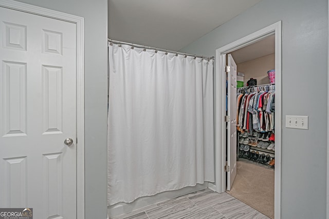 bathroom featuring curtained shower