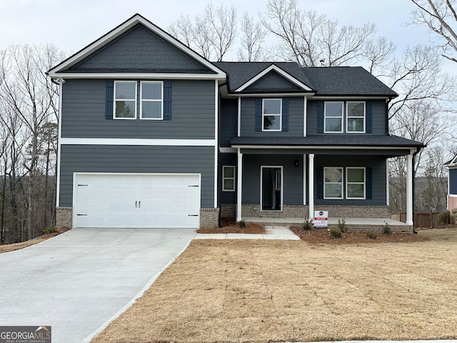 view of front of home featuring concrete driveway, a garage, brick siding, and covered porch