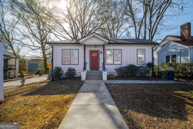 bungalow featuring board and batten siding