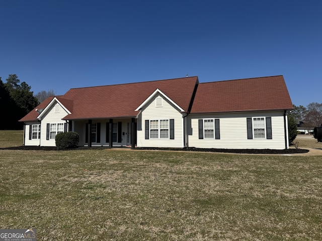 ranch-style home featuring a porch and a front yard