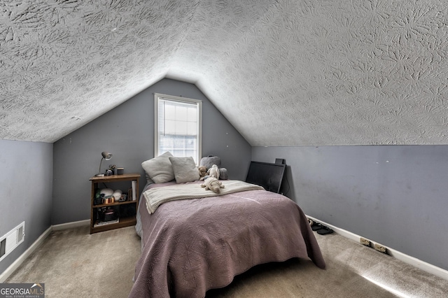 carpeted bedroom with visible vents, baseboards, a textured ceiling, and lofted ceiling