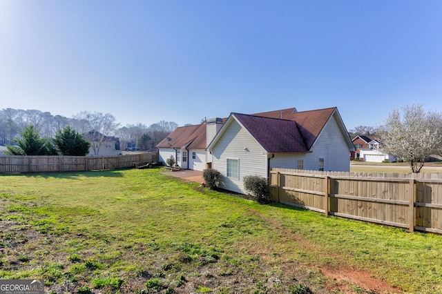 view of yard featuring a fenced backyard