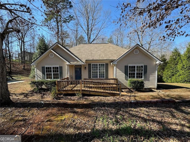 ranch-style home featuring a wooden deck