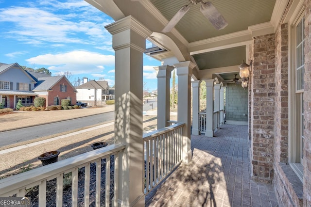 view of patio / terrace featuring a porch and a residential view