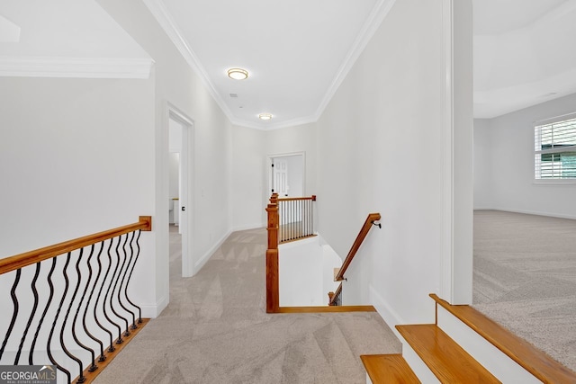 corridor with carpet flooring, an upstairs landing, and baseboards