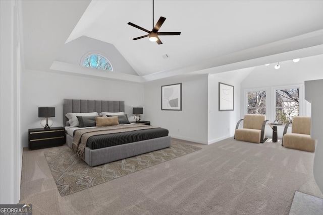 bedroom featuring multiple windows, baseboards, carpet, and ceiling fan