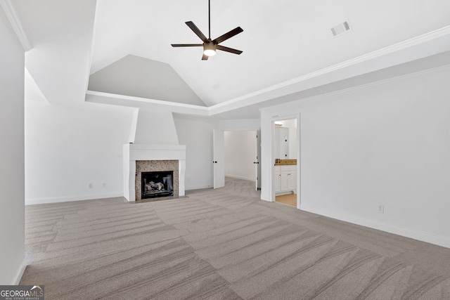 unfurnished living room with visible vents, high vaulted ceiling, carpet floors, a large fireplace, and ceiling fan