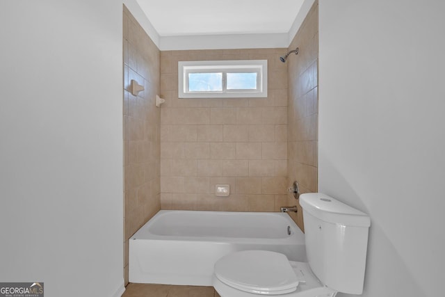 bathroom with  shower combination, toilet, and tile patterned floors