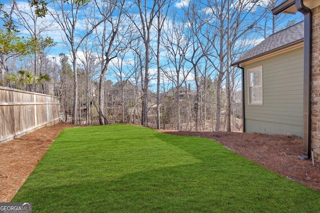 view of yard with fence