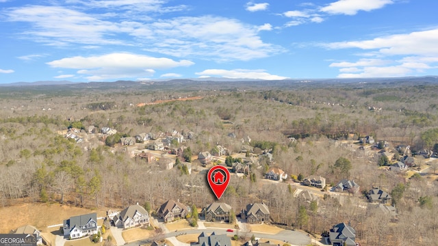 bird's eye view featuring a residential view, a mountain view, and a forest view