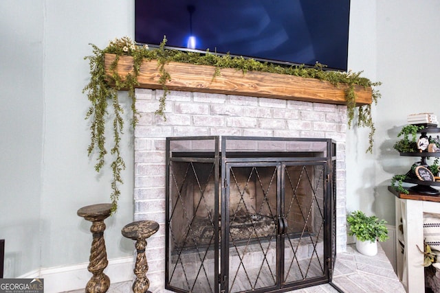 interior details with an outdoor brick fireplace