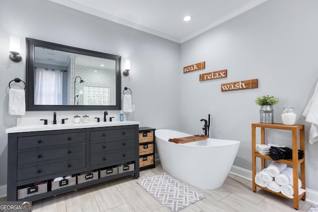 full bathroom featuring tiled shower, double vanity, a freestanding tub, a sink, and ornamental molding