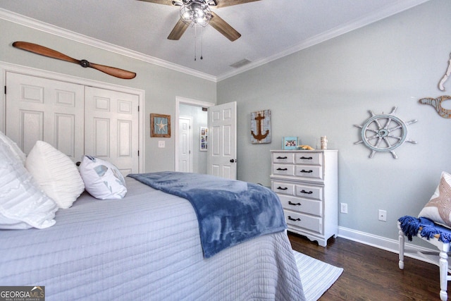 bedroom with crown molding, baseboards, a closet, a ceiling fan, and dark wood-style flooring