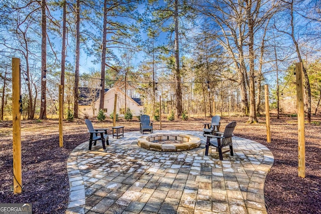 view of patio / terrace featuring a fire pit