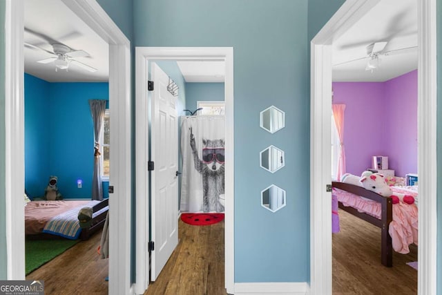 corridor with wood finished floors