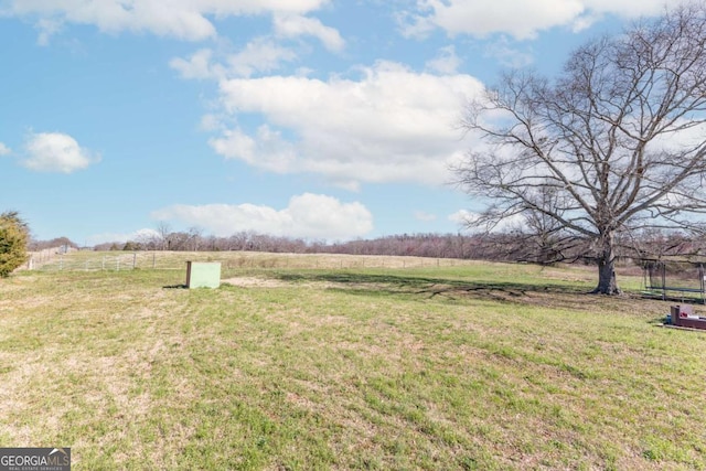 view of yard with a rural view