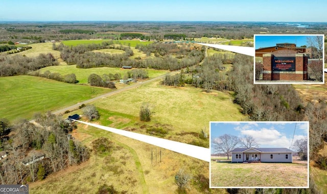 birds eye view of property with a rural view