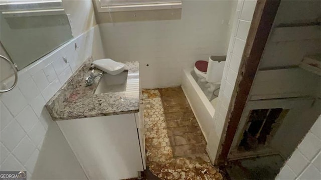 bathroom with tile walls