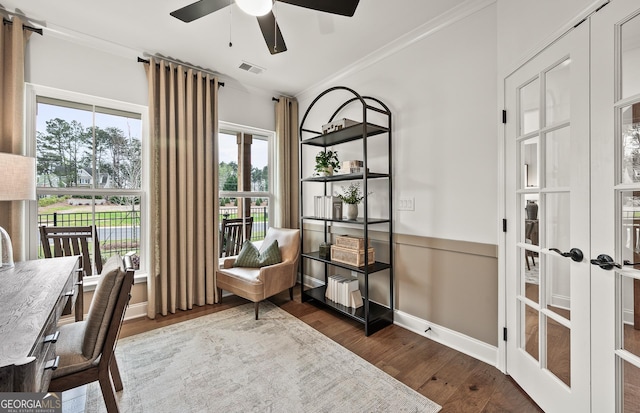 living area featuring visible vents, ceiling fan, ornamental molding, french doors, and dark wood-style flooring