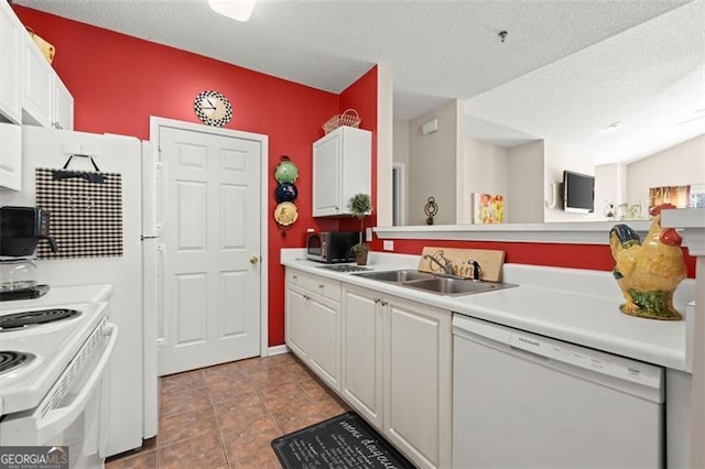 kitchen with white cabinets, white appliances, light countertops, and a sink