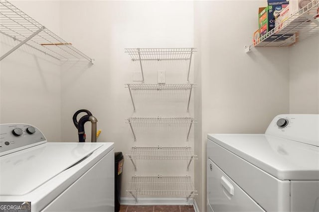 clothes washing area featuring laundry area and separate washer and dryer