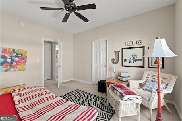 bedroom with baseboards and light colored carpet