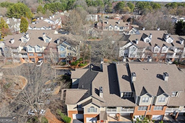 birds eye view of property with a residential view