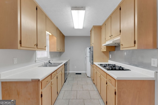 kitchen with light tile patterned flooring, a sink, black appliances, light countertops, and under cabinet range hood